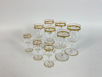 a lot of wine glasses that are sitting on the table