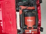 a red tool box with a red drill and other tools in it