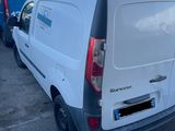 a white van that is parked in a parking lot
