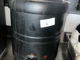 an image of a black pot sitting on a table