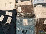 several pairs of men ' s t - shirts on display in a store