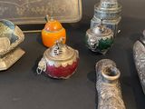 a lot of silver and glass items on a table