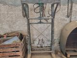 a small oven sitting next to a pallet in a building