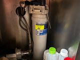 a container of water next to a container of food