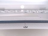a close up view of a laptop with a button on the keyboard
