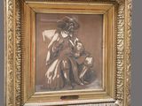 an old picture of a woman sitting in a chair with a dog