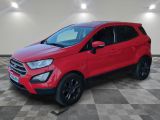 a red ford eco - pace suv parked in a showroom
