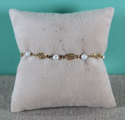 a close up of a cushion with a pillow on it