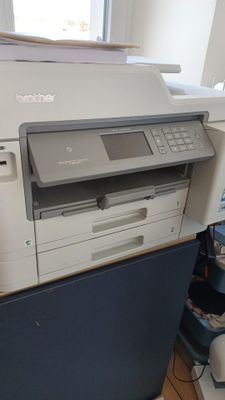 a printer that is sitting on top of a desk