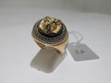 an image of a gold ring with a lion head on it