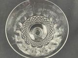 a glass bowl that has a spiral design on it