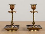 two candles that are sitting on a table