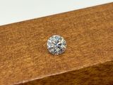 a close up of a diamond sitting on top of a wooden box