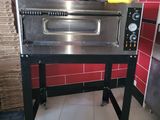 an image of a commercial pizza oven in a kitchen