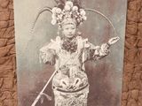 a picture of a woman dressed in a costume and holding a sword