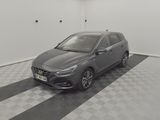 an image of a grey car in a garage