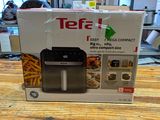 a box of tefa air fryer sitting on a table