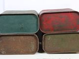 four tins of different colors are stacked on top of each other