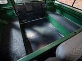 a view of the inside of an old green truck