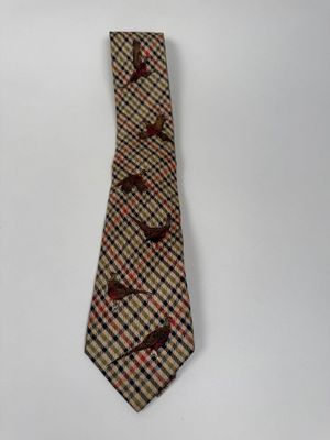 a neck tie with birds on it on a white background