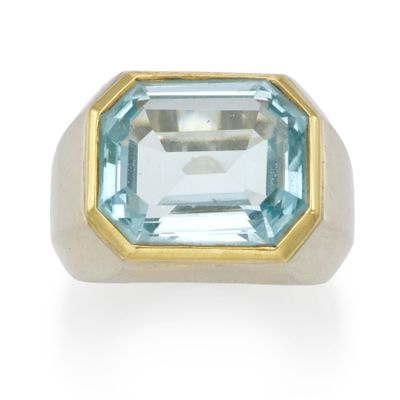 an image of a ring with a blue topazt stone in it