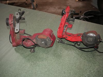 two tools that are sitting on top of a table