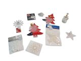 a small assortment of christmas decorations on a white surface