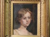 un tableau représentant une jeune fille, dans un cadre doré