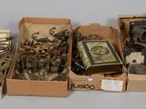 several boxes of assorted items sitting on top of a white surface