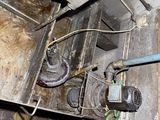 a water heater that is in a dirty room