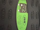 an image of a close up of a black suitcase with a green sticker on it