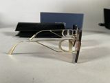 glasses are sitting on a table next to a blue card