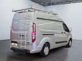 a silver van with a ladder on the back of it