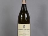 a bottle of wine that is sitting on a table