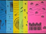 several different colored books with pictures of different things on them