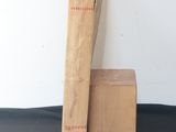 a cardboard box and a wooden box on a black surface