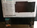 a box with a microwave on top of it on a table