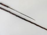 an image of a pair of walking sticks on a white surface