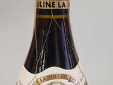 a bottle of wine that is sitting on a table