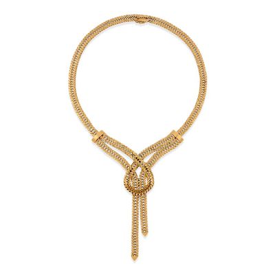un collier en or avec un nœud et une chaîne