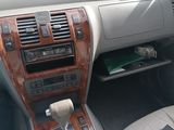 a dashboard of a car with a paper in it