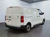 a picture of a white van parked inside of a building