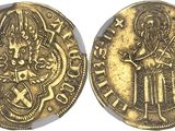 a gold coin with an image of a man holding a sword