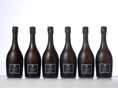 six bottles of champagne lined up in a row