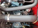 a close up view of the engine of a red car