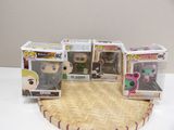 three pop vinyl figures are sitting on top of a basket
