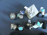 a lot of different rings and rings on a table