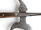 a large knife with a long blade on a white surface