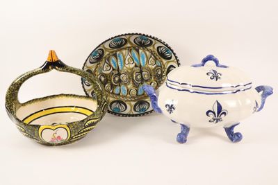 three different pieces of pottery sitting on a white surface