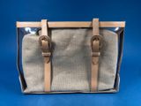 a beige and brown bag with two handles on a blue background
